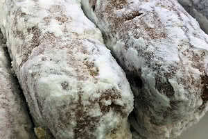 Powdered Long John Cream Filled Donut